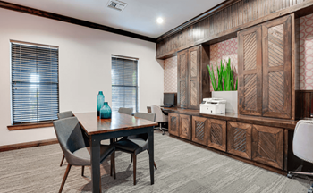 a meeting room with a desk and chairs  at Wind Dance, Carrollton, TX, 75010